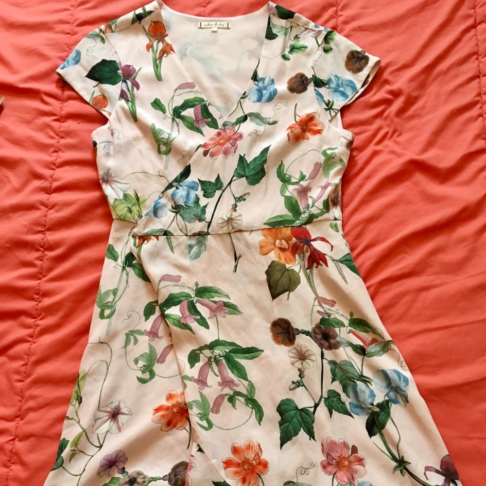 Wrap dress, fit and flare style. Frilly and girly